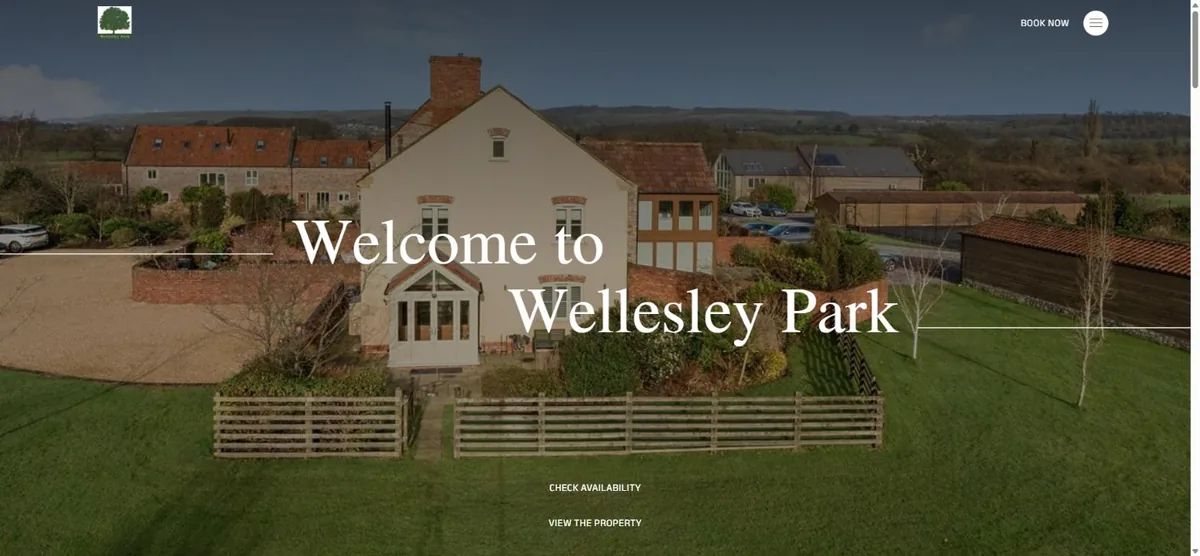 Wellesley Park homepage: aerial photograph of a cream farmhouse and barn conversions with a welcome headline overlaid.